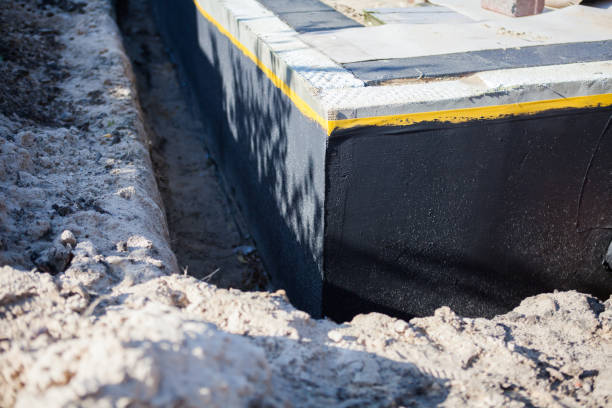 Professional Basement Waterproofing technician working in Moscow, PA